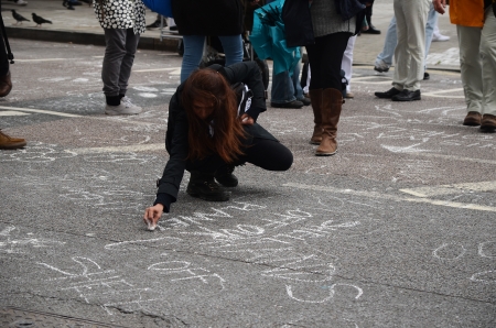 London â September 15: As part of the Aurora the Polar bear march campaigners peacefully protest by putting chalk messages outside the Shell building, London September 15th, 2013 in London England.のeditorial素材