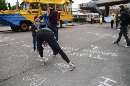 London â September 15: As part of the Aurora the Polar bear march campaigners peacefully protest by putting chalk messages outside the Shell building, London September 15th, 2013 in London England.のeditorial素材