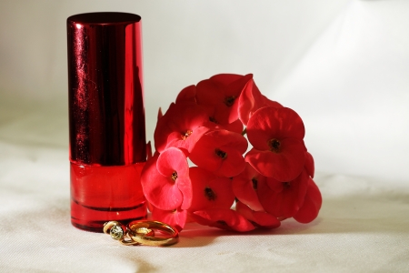 ring perfume and red flowerの写真素材