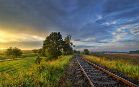 September sunset on the tracks outside the cityの写真素材