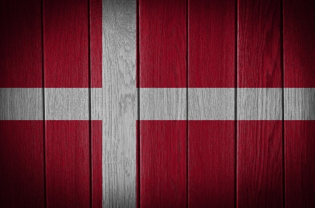 denmark, danish flag painted on old wood plank backgroundの写真素材