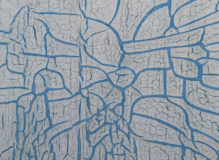 Cracked paint on wooden background, texture. Vintage wallpaper