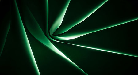 A close-up, abstract view of a green spiral pattern, possibly fabric or plant material, with dramatic lighting.の素材