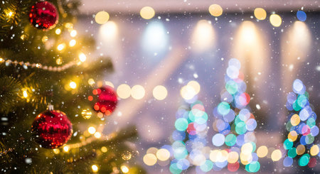 Capture the magic of Christmas with this festive tree and beautiful bokeh lights fallingの素材