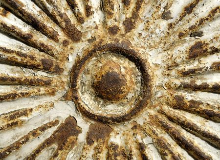 Rusty metallic sun figureの写真素材