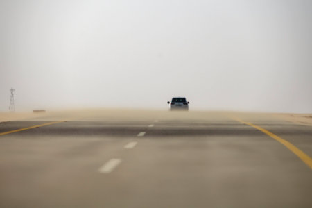 Sand storm in desert road Saudi Arabiaのeditorial素材