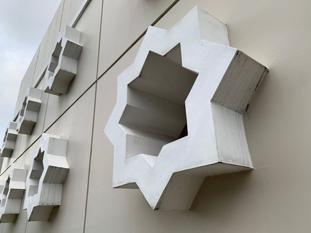Symmetrical White Star-Shaped Openings on Walls of Modern Geometric Architectural Detailsの写真素材