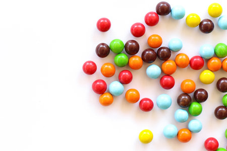 Colorful candies on white background. Top view. Copy space.の写真素材