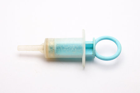 Used Medicine Feeder on white Backgroundの写真素材