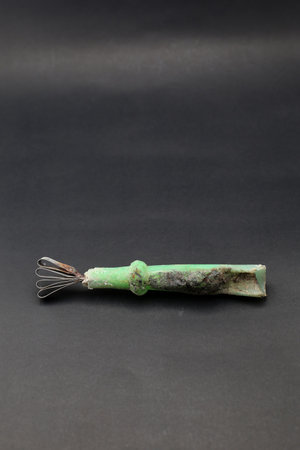 Used and rusty fruit curler, Grater or serutan, kerokan buah on a black backgroundの写真素材