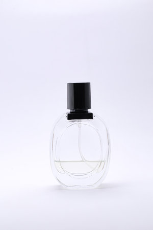 Elegant Glass Perfume Bottles Against a Minimalist White Backgroundの写真素材