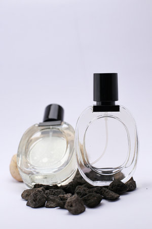 Elegant Glass Perfume Bottles Against a Minimalist White Backgroundの写真素材