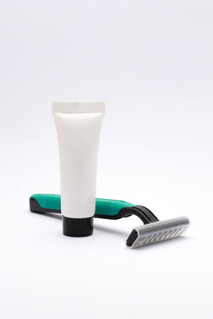Close-Up of Isolated Razor and Cream for Personal Grooming and Hygieneの写真素材