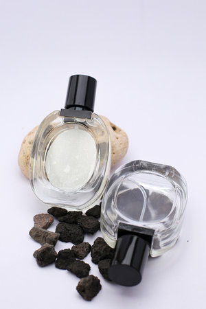 Elegant Glass Perfume Bottles Against a Minimalist White Backgroundの写真素材