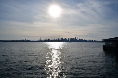 A silhouette of downtown Vancouver and the sea.    BC Canadaの写真素材