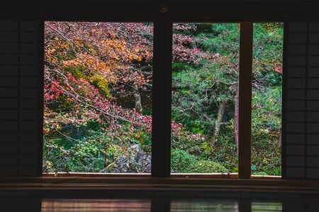 Colorful Autumn Scenery Beyond the Door-to-Door Contrasting Greatly with the Dark Interior.    Nanzeninn Kyotoの写真素材