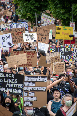 Juntenth Protestors holding up signs during anti-racism march.   Vancouver BC Canada June 19th 2020のeditorial素材