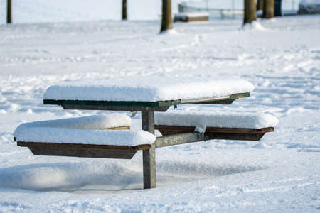 A picnic table in the park covered in snow.   Vancouver BC Canadaãの写真素材