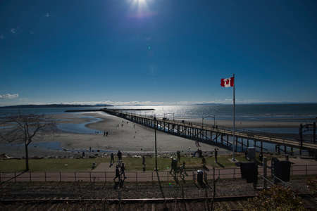 A long pier on the shallow of White Rock.    White Rock  BC  Canadaの写真素材