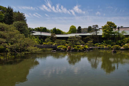 The stone bridge and the garden pond of Shinen inside the Heian-Jingu shrine.  Kyoto Japanの写真素材