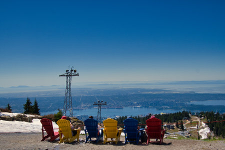 6 deck chairs on Grouse Mt. and the panorama view of Vancouver BC Canadaの写真素材