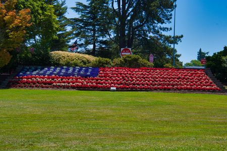 The American flag made with the red, white and blue flowers. Peace Arch Park US and Canada borderの写真素材