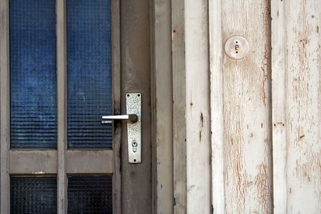 entrance with door handle of an old wooden houseの写真素材