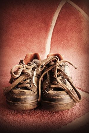 Beautiful old sport shoes of a little boyの写真素材