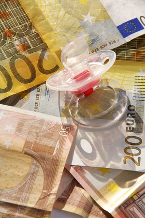 Babys silencer with many bills of euroの写真素材