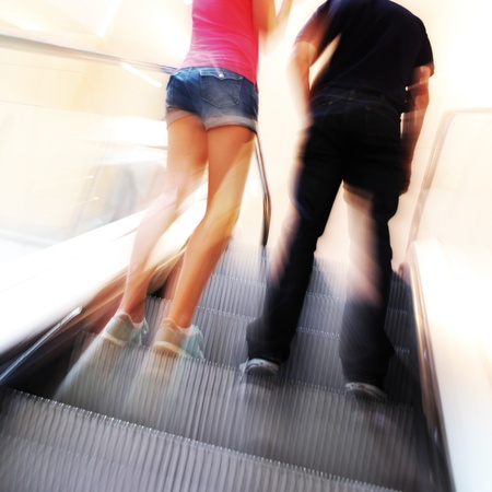 blurred unrecognizable people in motion in a shopping mallの写真素材