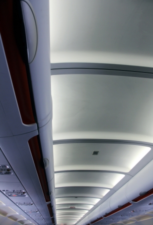 the modern ceiling in the aeroplane with lightsの写真素材