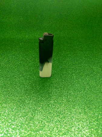 Lighter on Green Sparkle Textureの写真素材