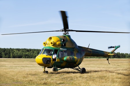 Minsk, Belarus on 18-19 July 2015. Air sports festival "Clean Sky" Passenger helicopters Mi-2 and Robinson, at work, flying in the air, taking off and landing, transportation of passengers.のeditorial素材