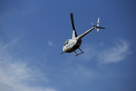 Minsk, Belarus on 18-19 July 2015. Air sports festival "Clean Sky" Passenger helicopters Mi-2 and Robinson, at work, flying in the air, taking off and landing, transportation of passengers.のeditorial素材