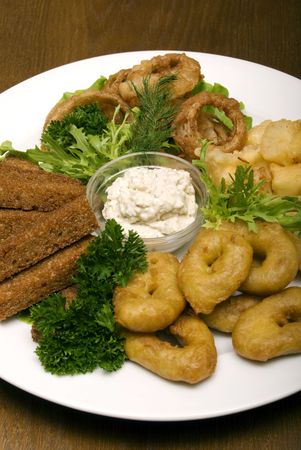  Appetizer made of fried onion, potato and breadの写真素材