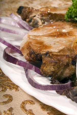 Fried juicy meat served with vegetablesの写真素材