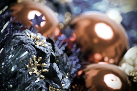 Red Christmas ball with blue tinsel and flowers close-upの写真素材