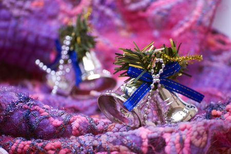 Christmas bells  on the soft colorful materialの写真素材