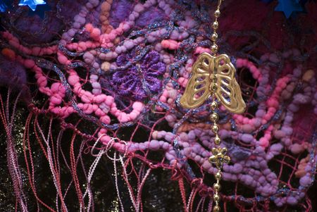 Colorful textiles and hanging metall butterfly の写真素材