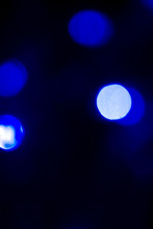 Glittering blue lights  on the dark blue backgroundの写真素材