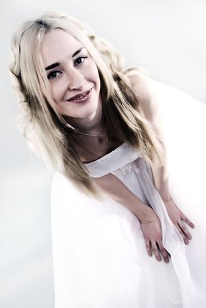 Young beautiful smiling  bride  with blond hair posingの写真素材