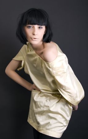 Portrait of a young beautiful fashionable brunette posing の写真素材