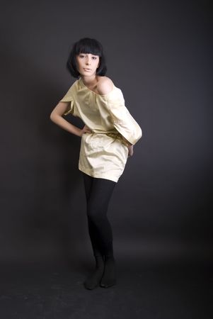 Portrait of a young beautiful fashionable brunette posingの写真素材