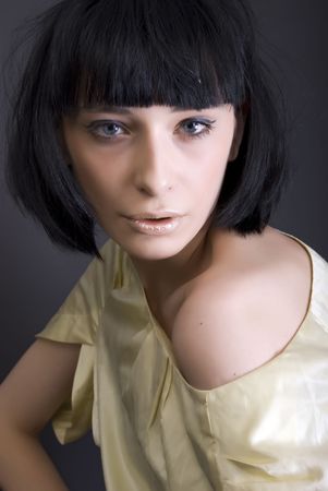 Portrait of a young beautiful fashionable brunette の写真素材