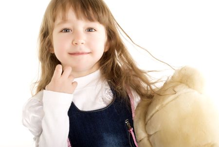 Beautiful little girl is holding her toy の写真素材