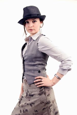 Portrait of a young  beautiful  fashionable brunette  in hat posingの写真素材