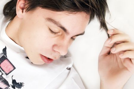 Young guy in deep relaxing with closed eyesの写真素材