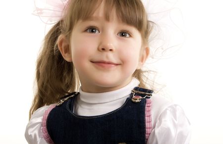 Beautiful little girl smiling over whiteの写真素材