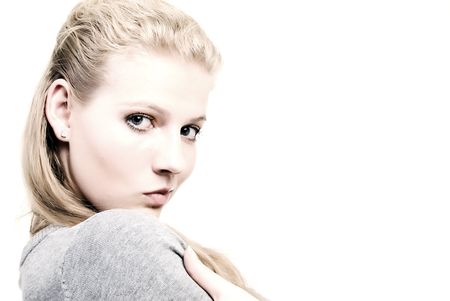 Portrait of a young beautiful blonde over whiteの写真素材
