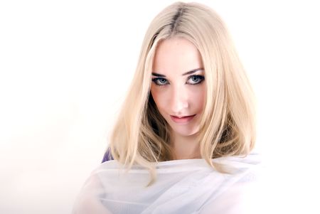 Portrait of a young beautiful blonde over whiteの写真素材